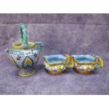 A Pair of Continental Majolica Jugs, each with three pouring lips, mythological figures to body