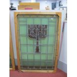 A Leaded Stained Glass Window of a Menorah.