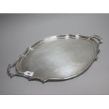 A Hallmarked Silver Twin Handled Tray, CA, London 1927, of plain shaped oval form, with shaped