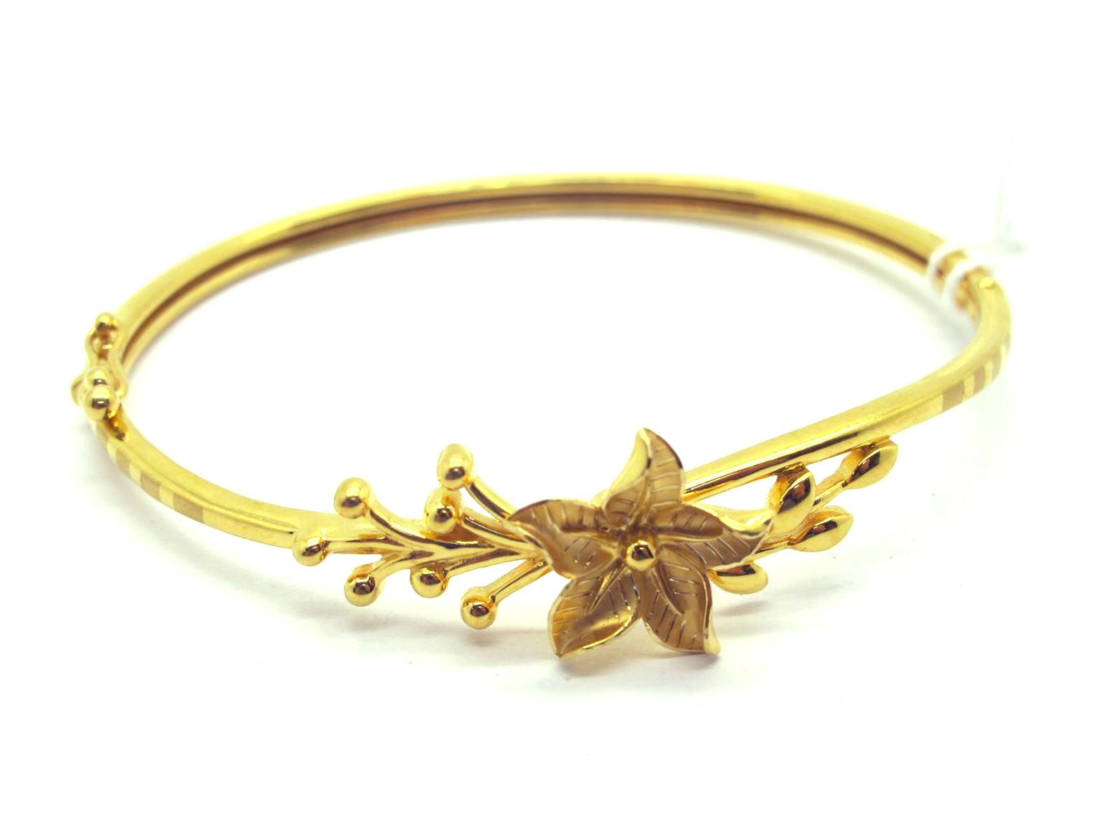 A Modern Hinged Bangle, with central flowerhead detail, hinged to snap clasp, stamped "KD 750