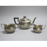 A Hallmarked Silver Three Piece Tea Set, JG, Birmingham 1907, each of semi reeded form with