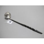 A Decorative Toddy Ladle, the allover decorated circular bowl inset with a 1758 George II