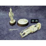 A Late XIX Century Japanese Ivory Figure, carved as a gentleman holding a cockerel and a chicken,