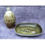 A Sam Haile Stoneware Rounded Rectangular Dish, resting on four peg feet, the centre with slip