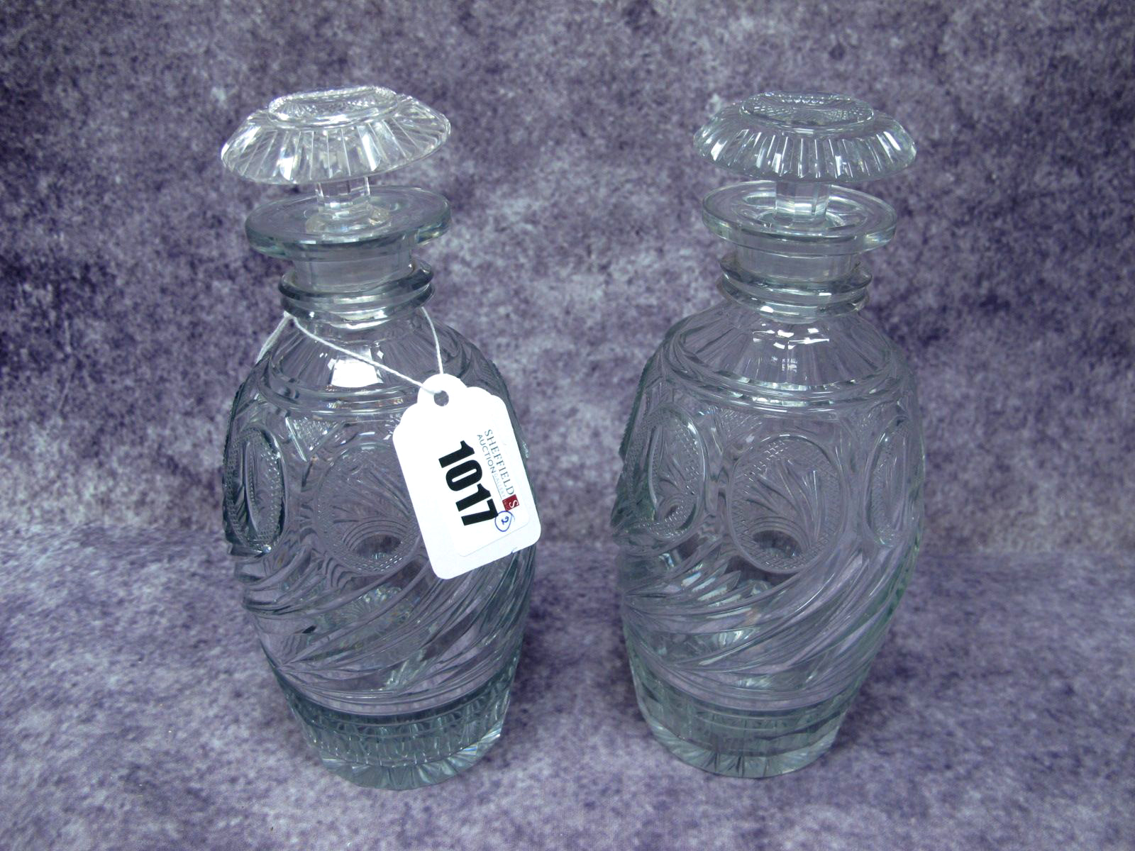 A Pair of Georgian Glass Decanters and Mushroom Stoppers, the ovoid bodies with oval hobnail cut