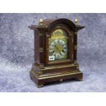 An Early XX Century Mahogany Cased Mantel Clock, with brass face and silvered chapter ring with