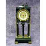 A Late XIX Century Bronze and Ormolu Mantel Clock, of Gothic design, the white enamel and brass dial