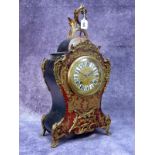 A Late XIX Century Boulle German Mantel Clock, with red tortoiseshell and ormolu mounts, the brass