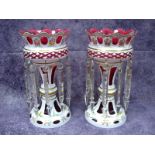 A Pair of Mid XX Century Bohemian Table Lustres, the cranberry glass bodies overlaid in white and