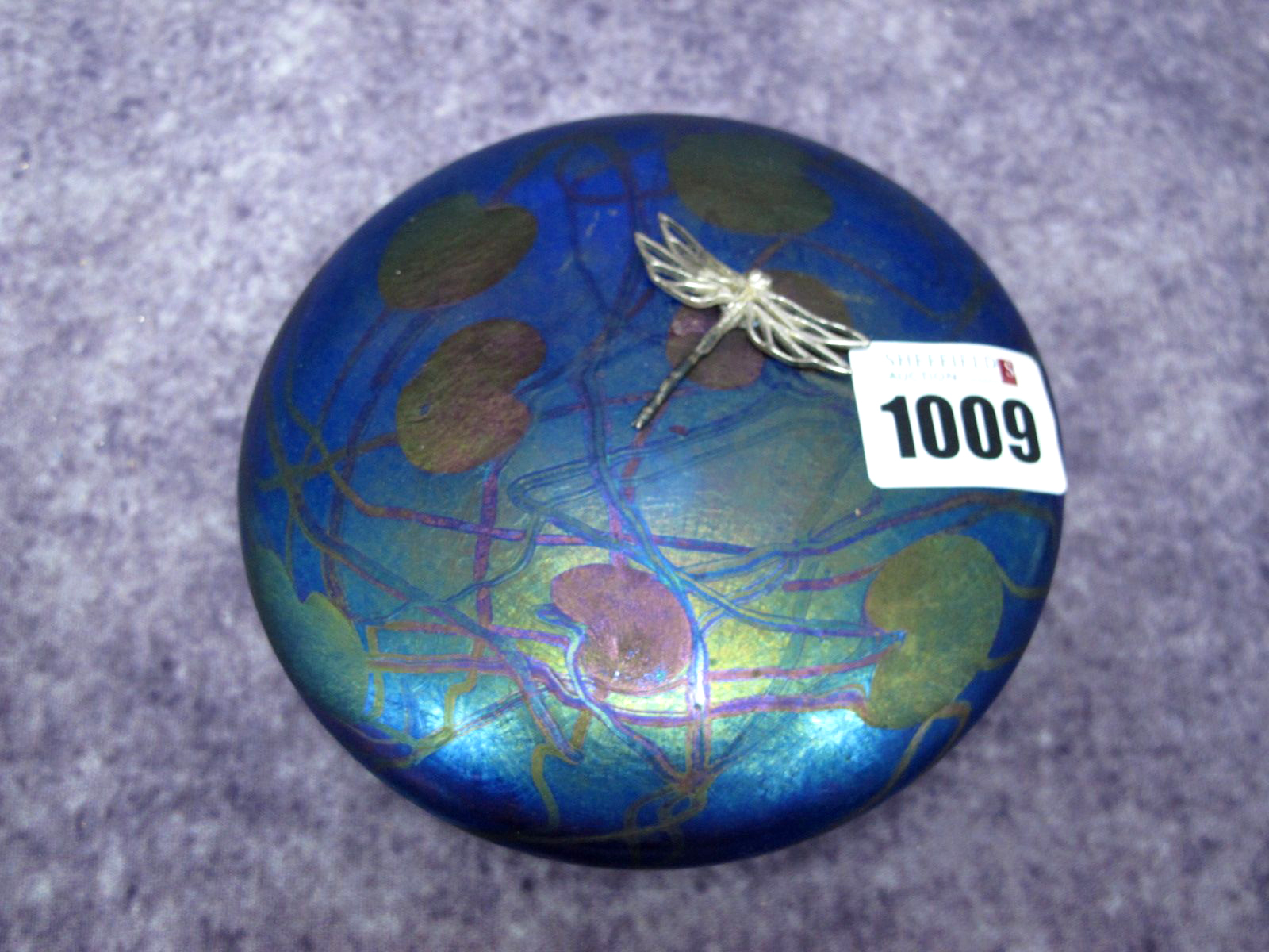 A Glasform by John Ditchfield Purple Iridescent Glass Lily Pad Paperweight, mounted with a