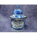 A Pearlware Tobacco Jar and Cover, inscribed "A Present For Mr Capes 1834", within a blue printed