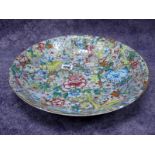 A Late XIX Century Chinese Dish, of circular form, painted in enamels with colourful flowers, 32.5cm