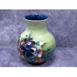 A Moorcroft Pottery Vase, of globular form with short outcurved neck, painted in the Freesia pattern