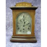 An Edwardian Mahogany Inlaid Chiming Mantel Clock, the silvered dial with Roman numerals with
