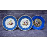 A Pair of Rockingham Porcelain Plates, the centres painted with flowers and fruit with blue border