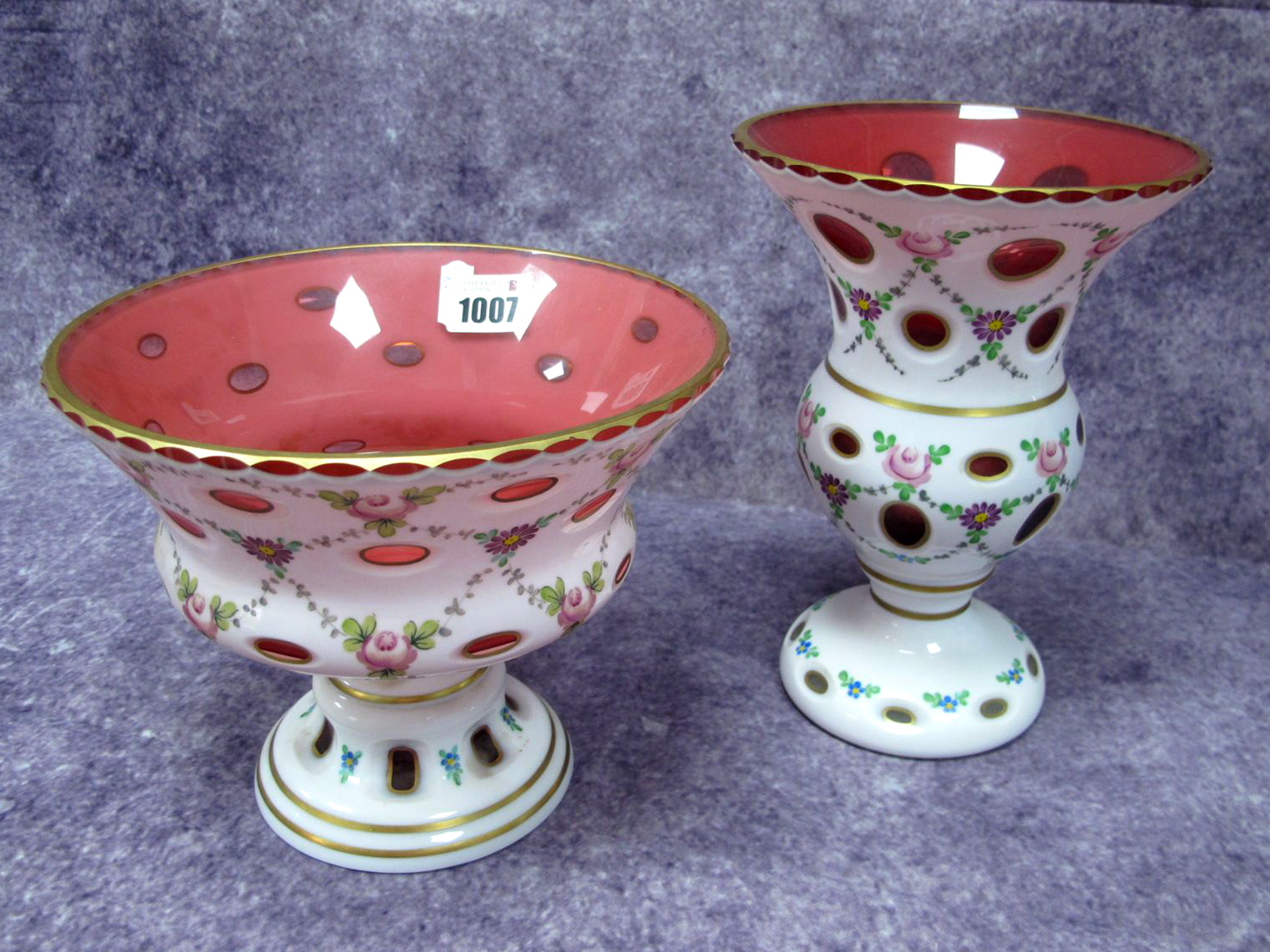 A Mid XX Century Bohemian Glass Pedestal Bowl, the cranberry ground overlaid in white and painted