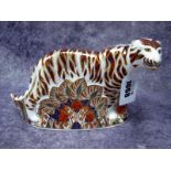 A Royal Crown Derby Porcelain Paperweight 'Bengal Tiger', gold stopper, 20cm long, no certificate or