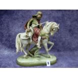 A Royal Dux Pottery Model of an Arab on Horseback, holding a rifle, dead game hung from his belt, on