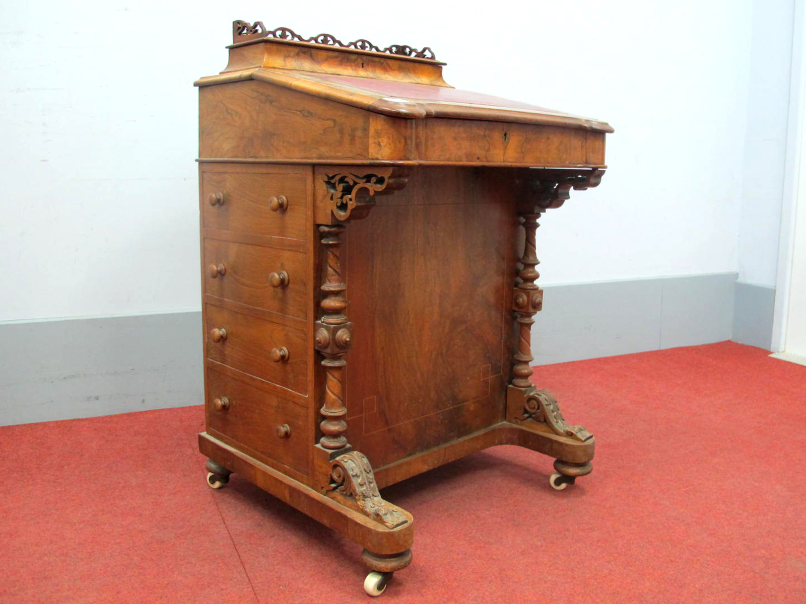 A Mid XIX Century Walnut Davenport, the upper section with three-quarter gallery and fitted