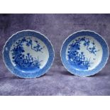 A Pair of Early XX Century Japanese Circular Plaques, decorated in blue with birds perched on