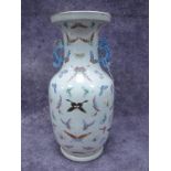 A Chinese Late XIX Century Pottery Floor Vase, of baluster form with seahorse handles and painted in