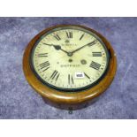A Burrell Sheffield Oak Cased Wall Clock, the cream enamel dial with Roman numerals, winder present,