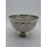 A Hallmarked Silver Bowl, FBs, Sheffield 1904, allover detailed in relief, on circular spreading