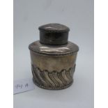 A Hallmarked Silver Caddy, HA, Sheffield 1905, of oval semi gadrooned form, with pull off cover (