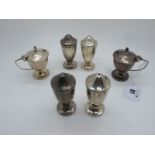 A Hallmarked Silver Six Piece Cruet Set, (marks rubbed) each of panelled form, on circulr