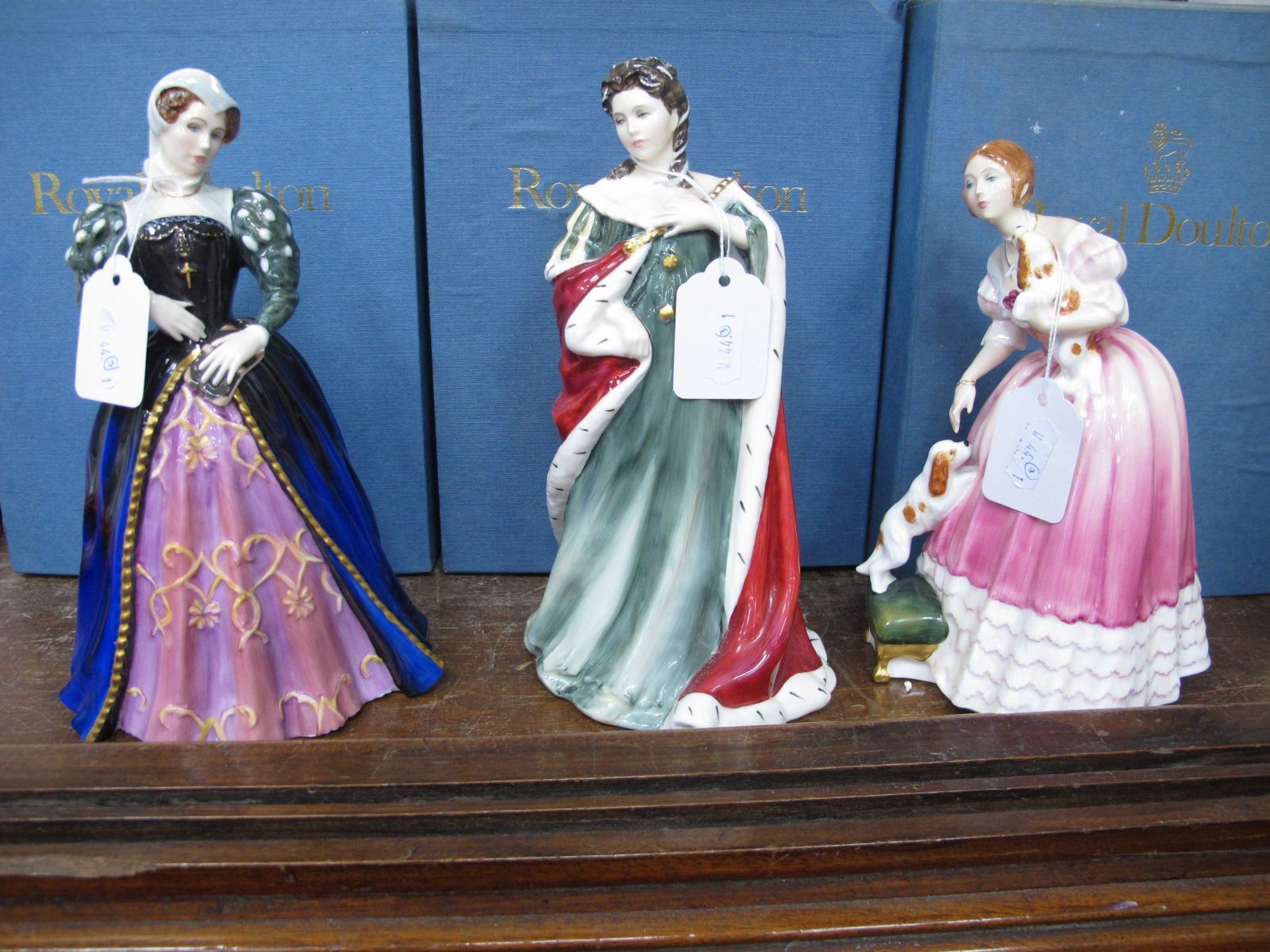 Royal Doulton Queens of The Realm Figurines, 'Queen Anne', Queen Victoria', and 'Mary Queen of