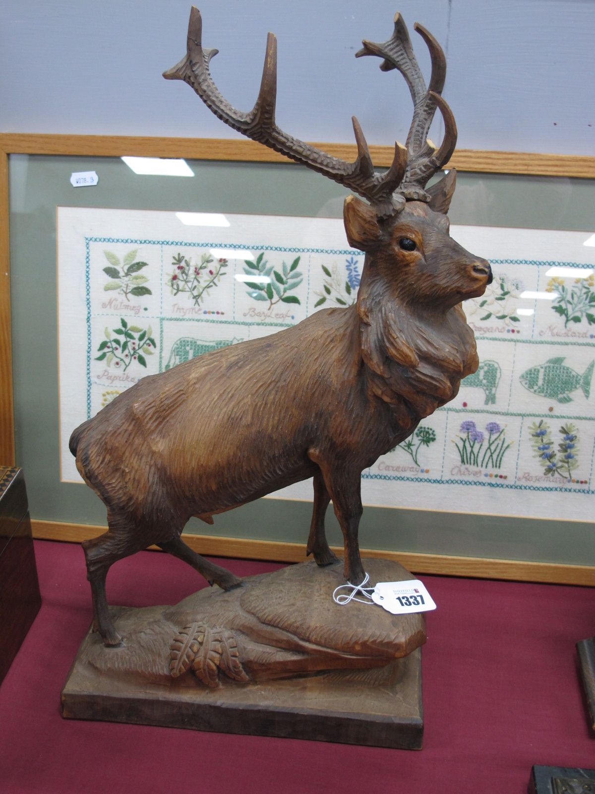 A Carved Soft Wood Figure of a Stag, surmounted on naturalistic base, 51cm high, (antler points