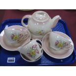 A Susie Cooper Tea For Two Tea Set, Kestrel shape with stylized flowers on pink ground, the tea