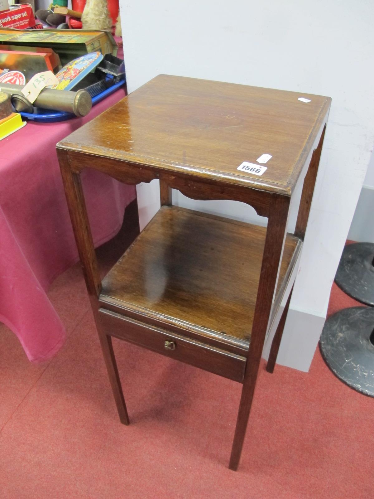 An Early XX Century Oak Jug and Bowl Stand, with a single drawer, on chamfered supports, 81cm high.