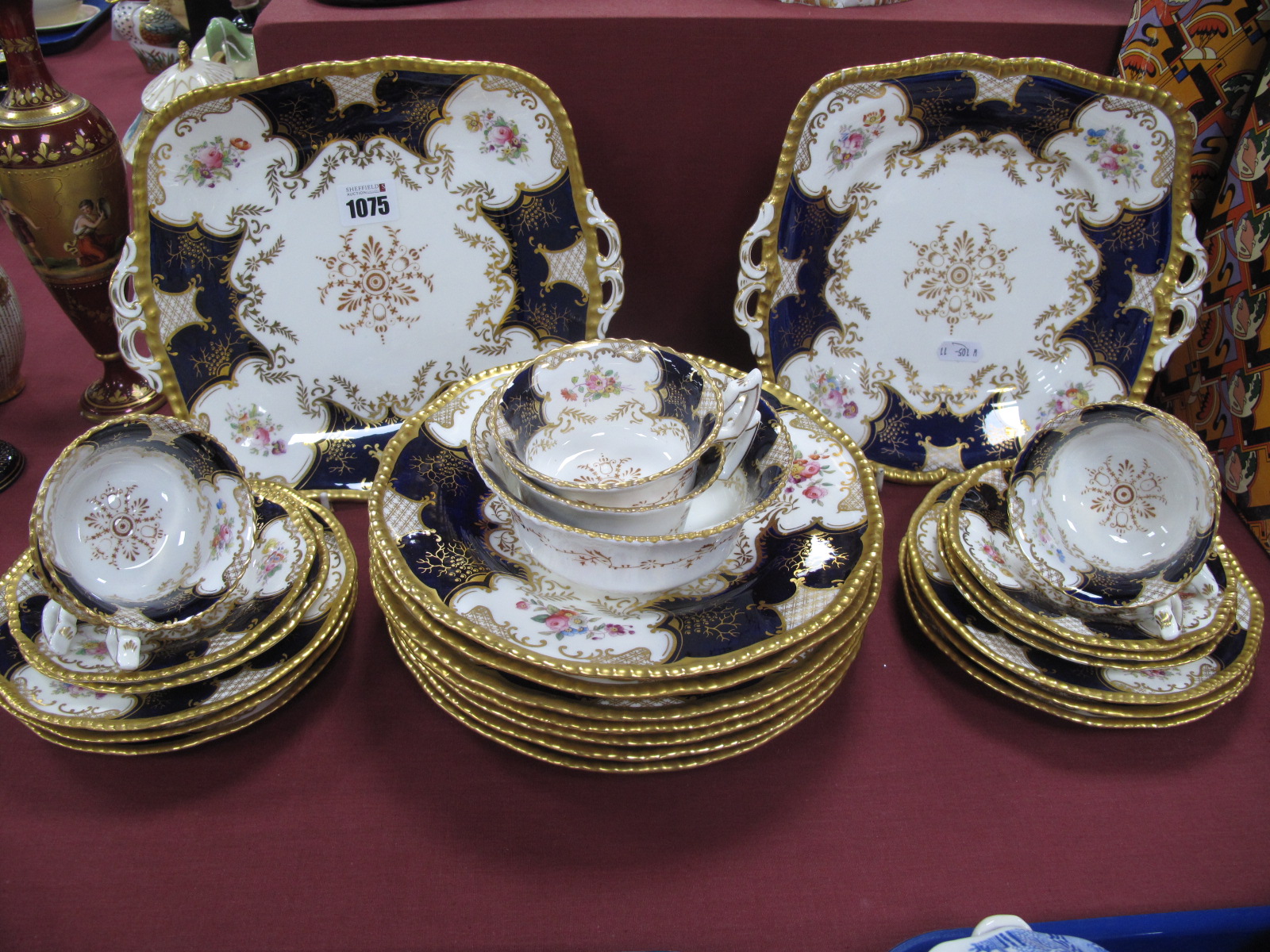 A Coalport Porcelain 'Bat Wing' Pattern Part Tea Service, printed and painted with panels of
