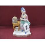 A Late XIX Century Meissen Style Porcelain Figure of a Seated Lady, with a bird in a cage beside