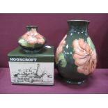 A Moorcroft Pottery Vase, of ovoid form, painted in the coral Hibiscus pattern against a green