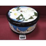 A Moorcroft Pottery Lidded Pot, painted in the 'Christmas Dawn' design by Paul Hilditch, shape 125/