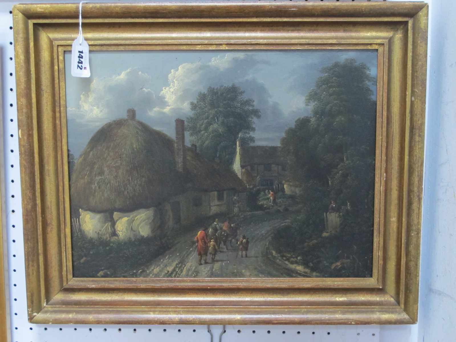 ENGLISH SCHOOL (Early XIX Century) Figure on a Country Lane Before Thatched Cottages, oil on