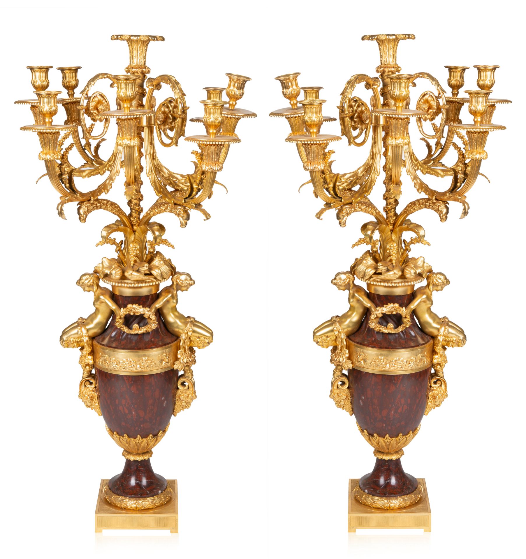 A PAIR OF FRENCH EIGHT-LIGHT LOUIS XVI-STYLE GILT-BRONZE AND ROUGE GRIOTTE MARBLE CANDELABRA, AFTER