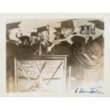 [EINSTEIN] A SIGNED PHOTOGRAPH OF EINSTEIN RECEIVING AN HONORARY DIPLOMA FROM YESHIVA UNIVERSITY, NE