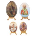 A SET OF FOUR LARGE RUSSIAN "SAINTS" PORCELAIN EASTER EGGS, ONE PAPIER-MACHE, PROBABLY LUKUTIN, IMPE