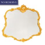 A ITALIAN RELIEF CARVED GILTWOOD CARTOUCHE SHAPED MIRROR, 2OTH CENTURY