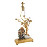 CHINESE GILT BRONZE AND PORCELAIN FIGURAL TABLE LAMP