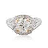 A CONTEMPORARY CUSHION CUT DIAMOND 14KT GOLD RING