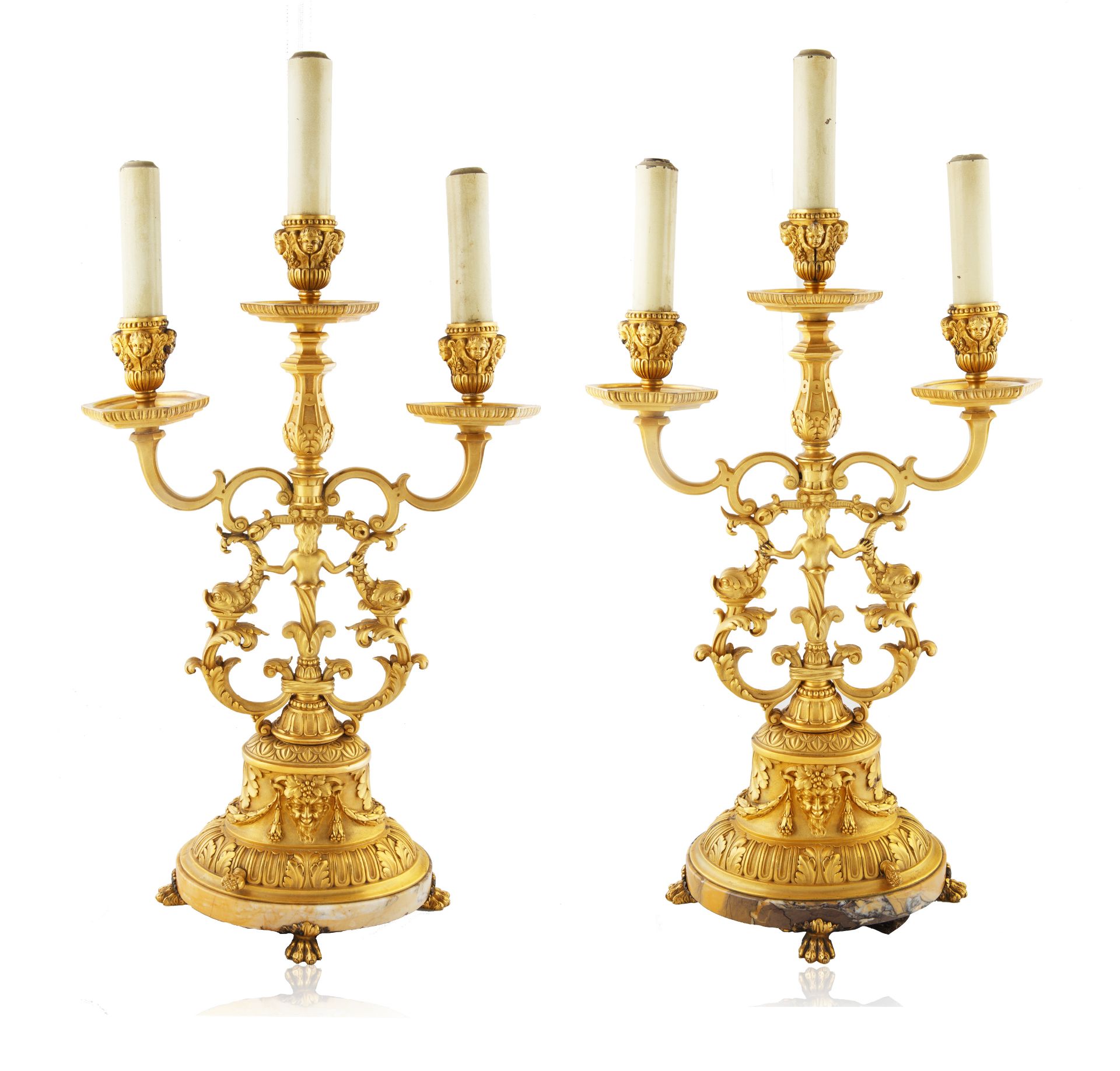 A PAIR OF BRONZE THREE-LIGHT ELECTRIFIED CANDELABRAS