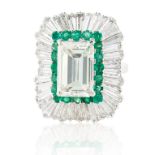 A 5.03 CT EMERALD CUT DIAMOND RING IN A BALLERINA SETTING