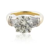 A 4.30 CT BRILLIANT ROUND CUT DIAMOND RING SET IN 18KT GOLD BAND