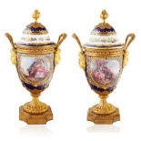 PAIR OF 19TH CENTURY SEVRES-STYLE PORCELAIN COVERED AND ORMOLU MOUNTED URNS