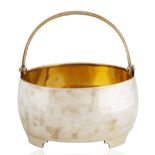 A FABERGE SILVER SUGAR BASKET WITH SWING HANDLE