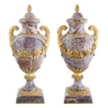 A PAIR OF ROUGE GRIOTTE MARBLE AND ORMOLU URNS